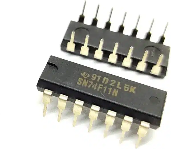 7411 triple 3-input AND gate IC in DIP package, digital logic IC for performing AND operations in combinational circuits.